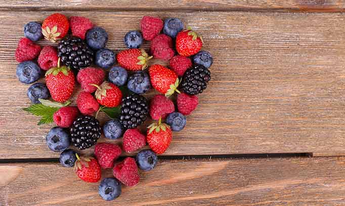 berries arranged in the shape of a heart, healthy valentines treats