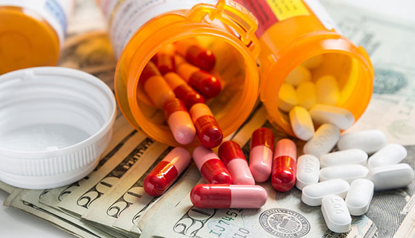 prescription pill vials with pills spilling out