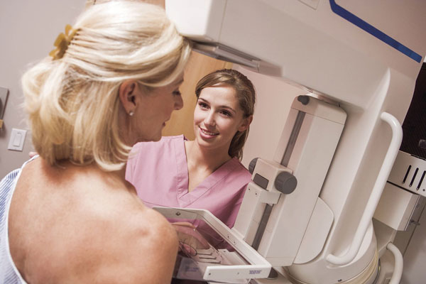 woman getting 3D mammogram