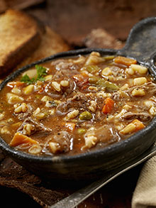 beef vegetable barley soup with crusty bread 186545730