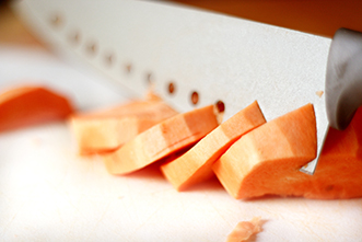 cutting up sweet potatoes