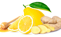 whole and sliced lemons and whole and sliced ginger root image 1300429742