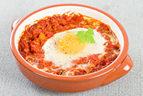 microwave eggs and tomato sauce over cauliflower steaks 511649419