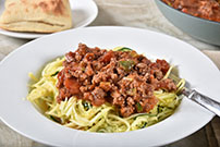 zucchini zoodles with ground beef and tomato sauce photo 1131957929