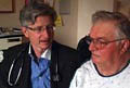 Dr. M. Nicholas Burke discusses heart health screening results with a patient.