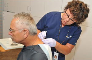 nurse cleaning wound