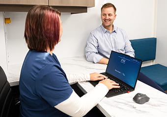 Care member speaking with patient