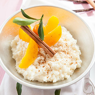 treat yourself to a sweet dessert of rice pudding with peaches
