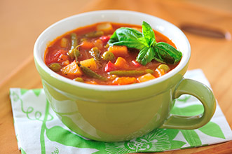 minestrone soup in mug cup