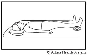 knee straightening stretch on bed