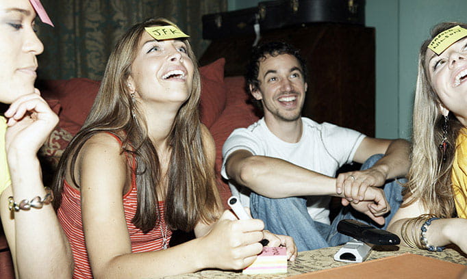 Young adults playing brain teaser game.