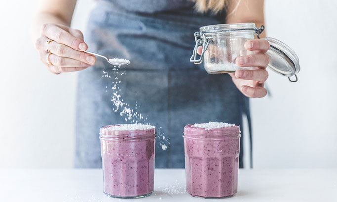 is this woman making a smoothie with an artificial sweetener?