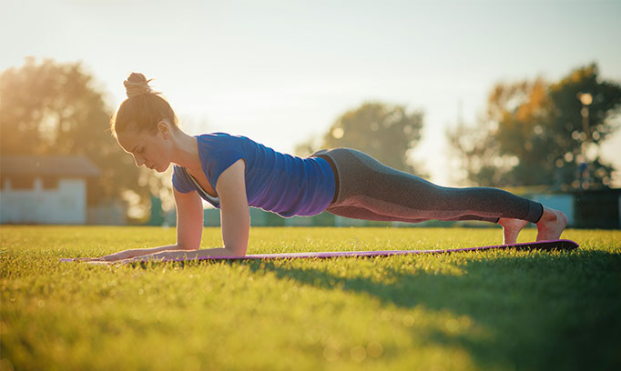 young woman doing plank exercise