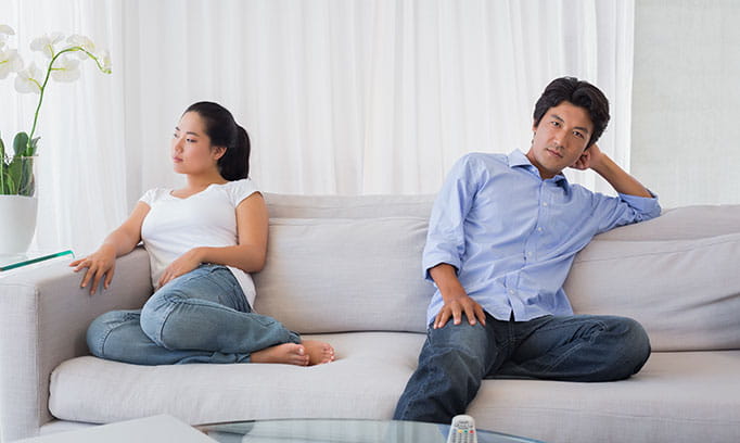 Two people looking away from each other as though embarassed to talk about shy bladder
