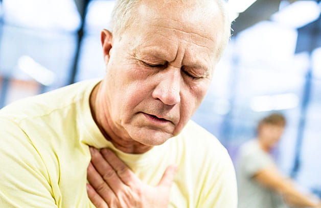 man experiencing symptoms of chronic reflux