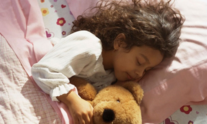 Young girl sleeping in advance of Daylight Saving Time