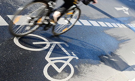Biker in city crosswalk