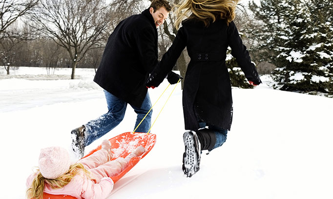 Couple dragging a sled