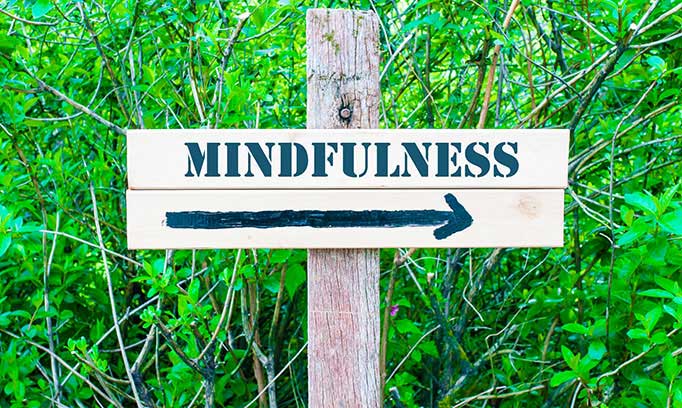 Mindfulness this way sign with an arrow