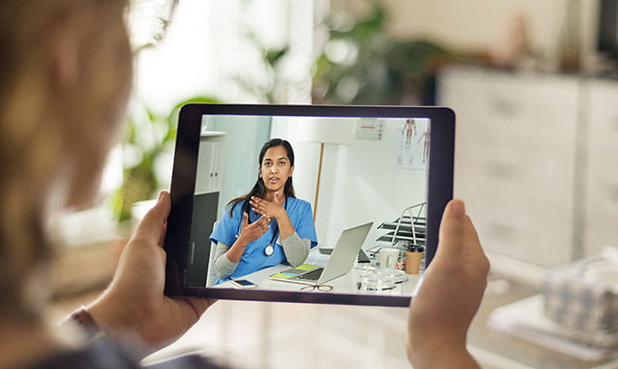 Doctor shares treatment for vaginal yeast infection over a virtual visit on a tablet 