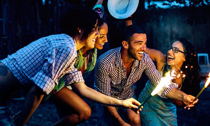 friends hanging out lighting a sparkler, the importance of friends