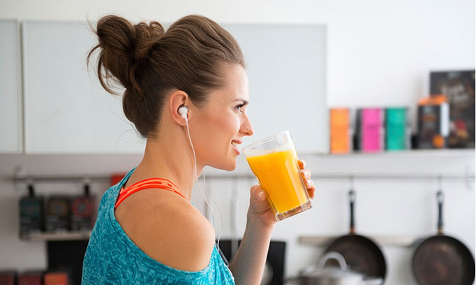 woman drinking a smoothie after a workout