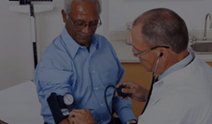 male getting blood pressure checked