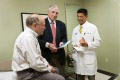 Dr. Jay & Dr. Maron discuss heart health screening results with a patient.