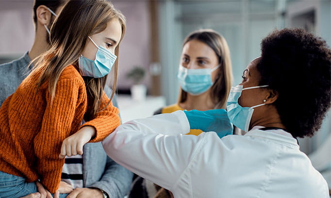 parents and child with their pediatrician