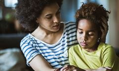 Mother comforting child feeling sad