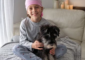 child-with-dog-post-whole-person-care-cancer-treatment