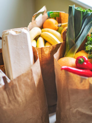 cancer patient quote about healthy eating showing bags of healthy groceries