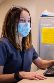 cancer care team woman at computer 184x279