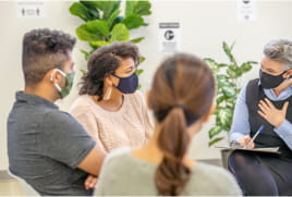 cancer support group listening to leader talking