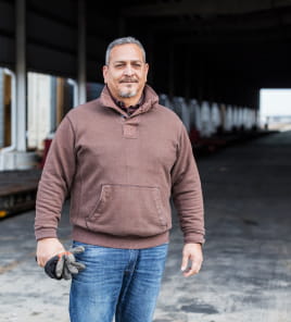 man outside with work gloves