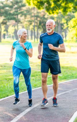 older couple run walking to prevent cancer