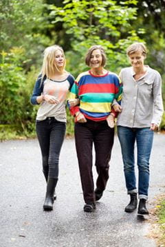 trio of women walking outside