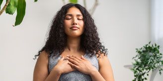 woman meditating 328x164