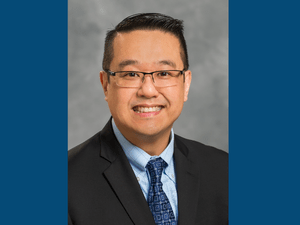 Dr Jim photo blue sides 300 x 225 px