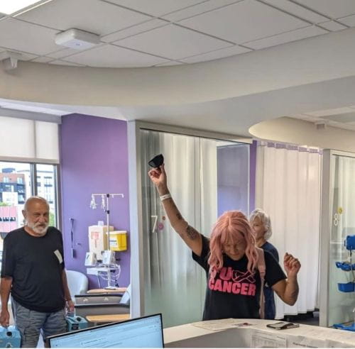 Gina Bello ringing the bell