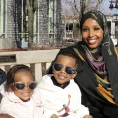 Hodan S with two children feed photo