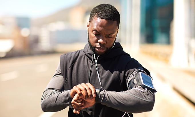 man checking his heart rate during exercise 2204 HSG Heart Rate
