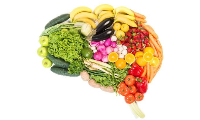 different colorful foods arranged in the shape of a brain