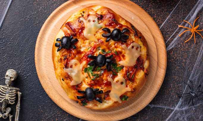 pizza with ghost decorations on top