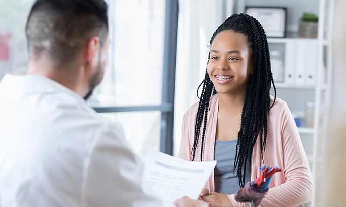 confident teen girl at doctor visit 