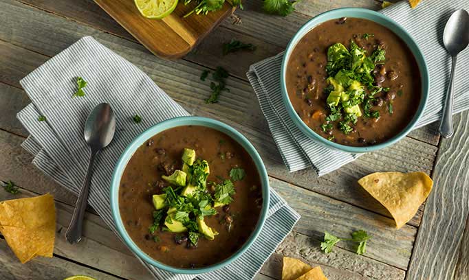 black bean slow cooker soup in two bowls