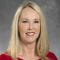 Headshot of Jill May, BSN, RN, OCN. A white female with shoulder length blonde hair. She is wearing a red sweater.