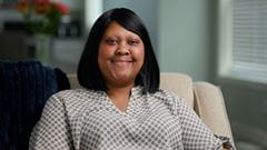 Nikka Ross seated and smiling